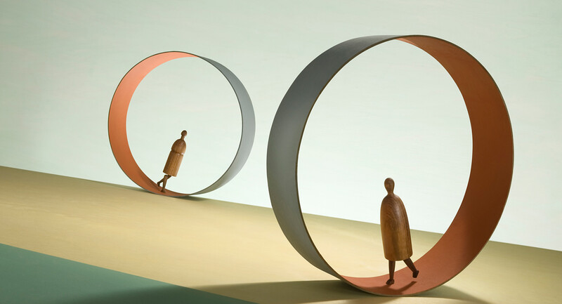 Two figures walking inside endless circular paths.