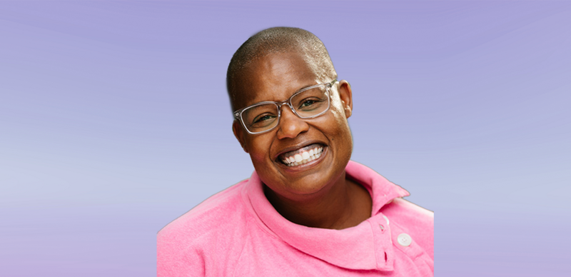 ASCD author Kimberly N. Parker, a smiling Black woman with closely shaved hair and wearing glasses and a pink sweater.