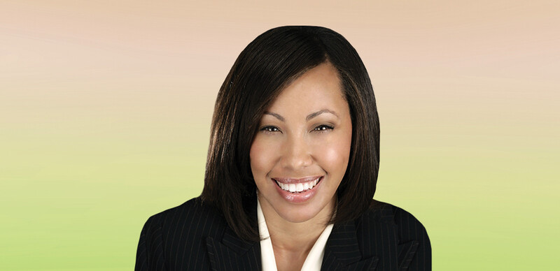 ASCD Author Robyn R. Jackson, a smiling Black woman with long black hair wearing a white shirt and black jacket.