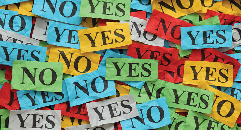 November 2021 Donohoo Thumbnail Image: Photo illustration of a pile of notecards that either say "YES" or "No"