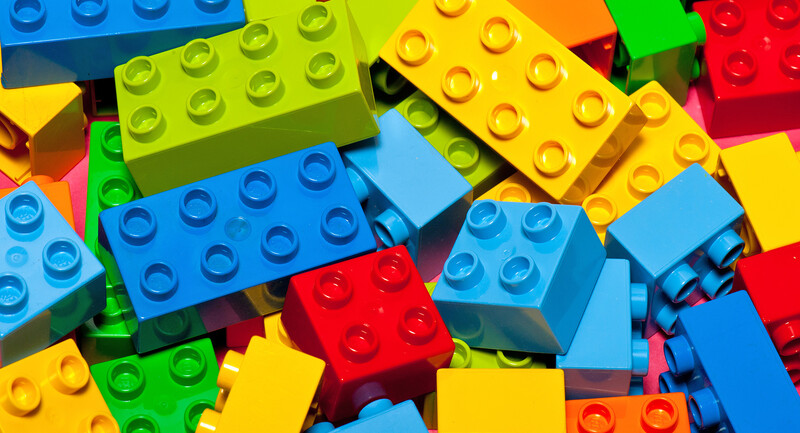 November 2021 Research Alert header image: Photo of a loose pile of legos.